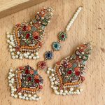 Naurtran earings teeka