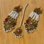 Naurtran earing teeka